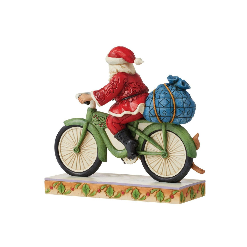 Santa Riding a Bicycle Figurine